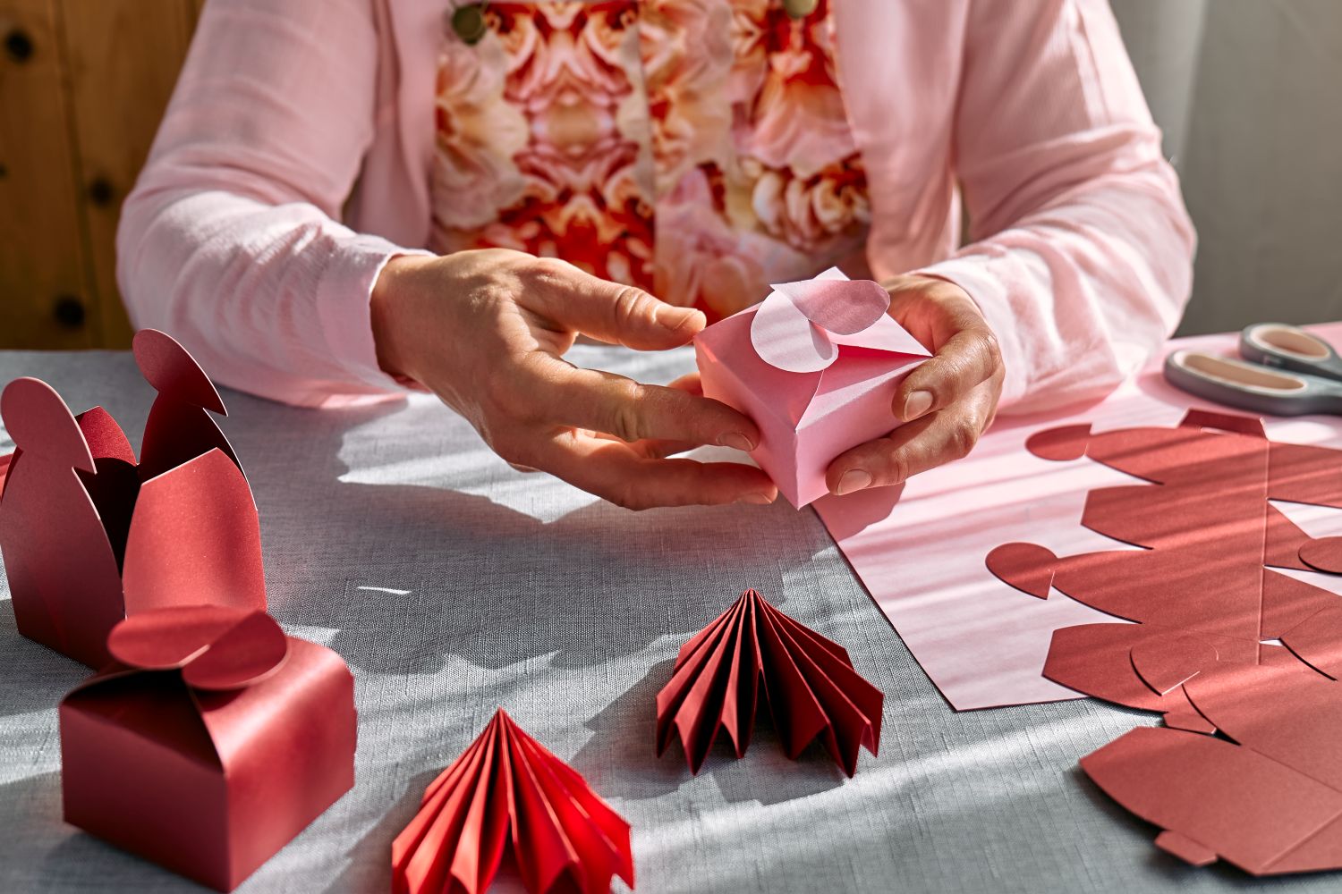 woman making decorated boxes